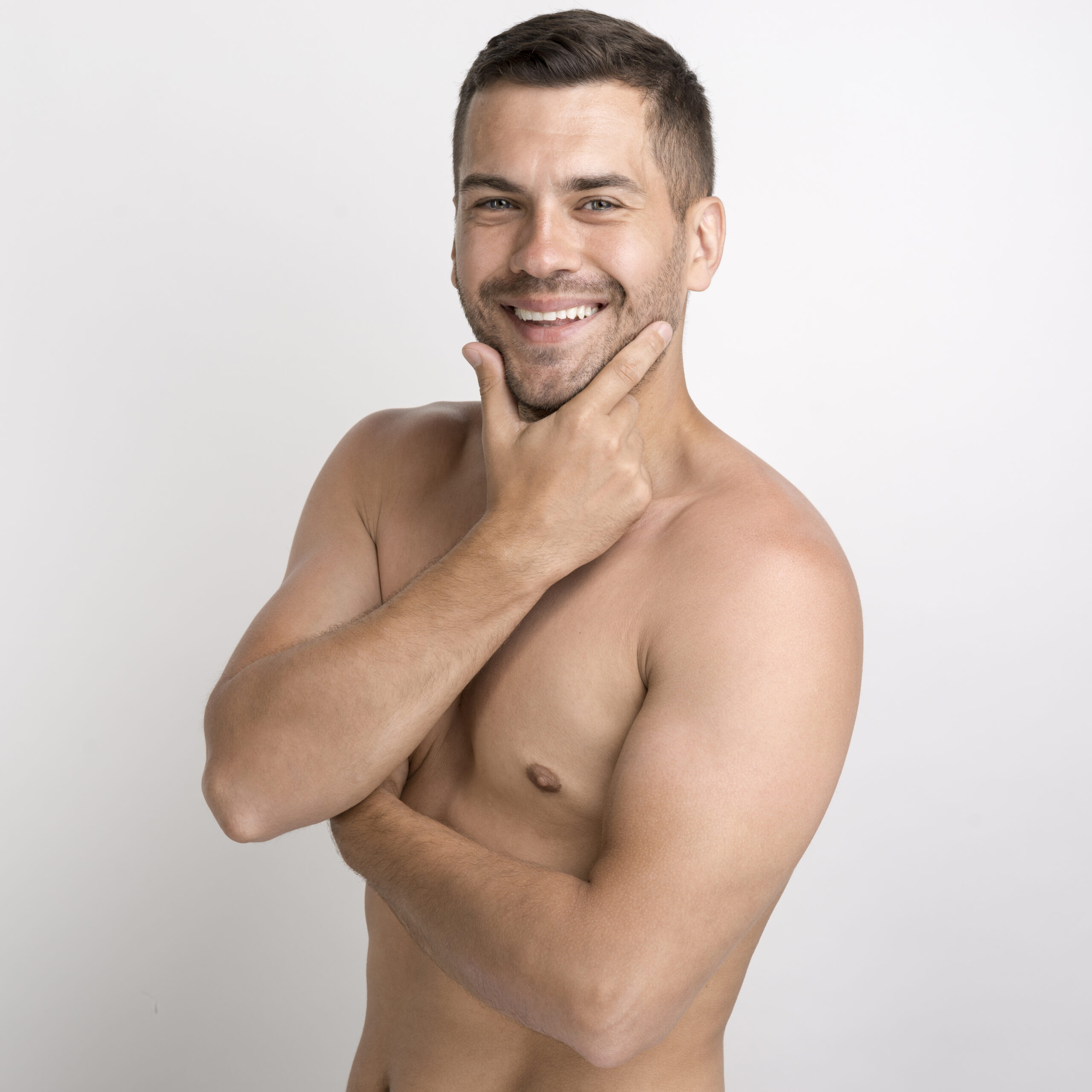 portrait-shirtless-smiling-young-man-keeping-hand-chin-looking-camera